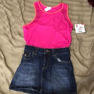 A tank top and mini denim skirt